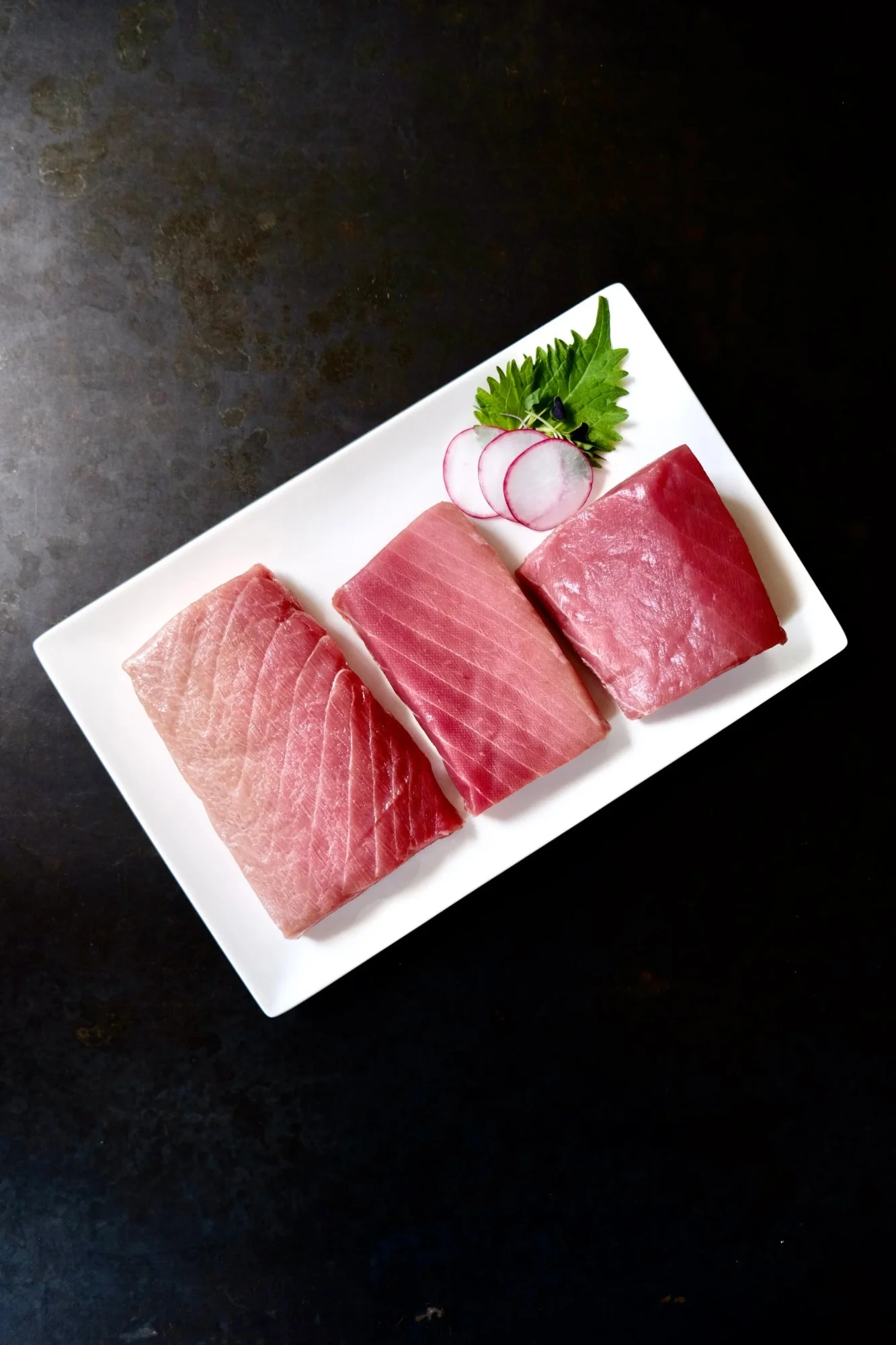 All three cuts of Nagasaki Bluefin Tuna side by side — Otoro, Chutoro, and Akami
