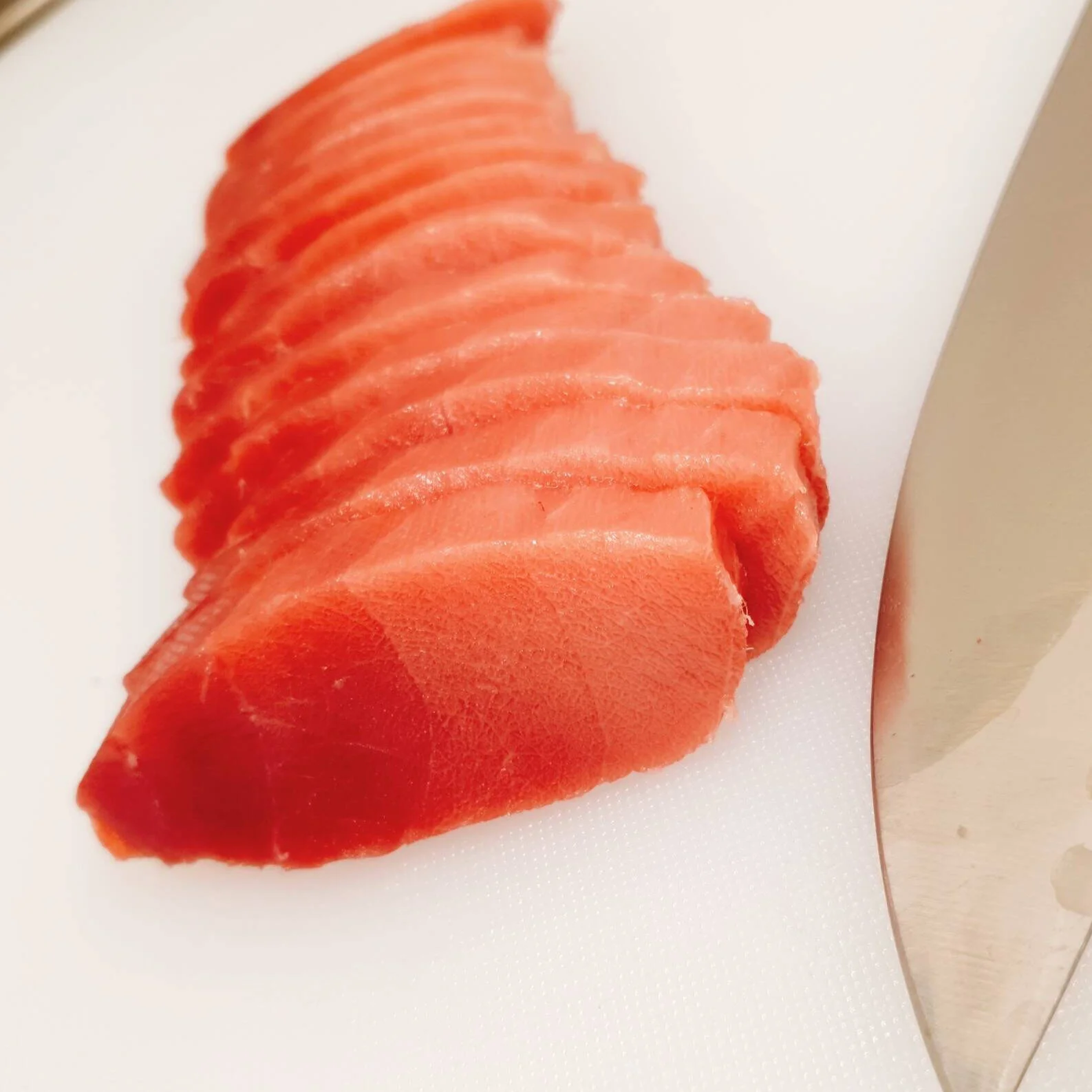 Nagasaki Bluefin Tuna Chutoro pieces lined on cutting board showing fat distribution